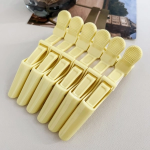 Set of six professional matte cream hair clips with non-slip grips and strong spring design