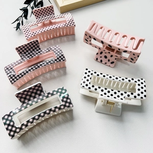 Detailed set of hair claw clips featuring polka dots, houndstooth, and animal prints