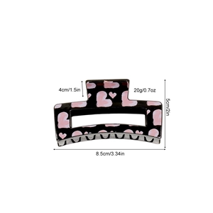 Rectangle black hair claw clip with pink heart patterns and sturdy metal spring