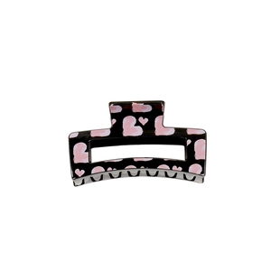 Large black hair claw clip with pink graffiti hearts and glossy rectangular hollow design