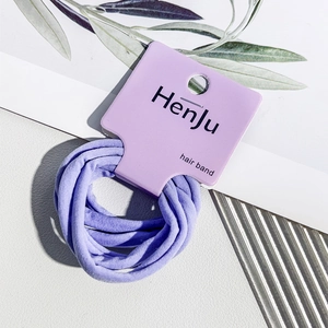 Detail view of purple seamless high-elastic hair bands on a brand display card
