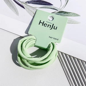 Detail of mint green hair bands set on a display card with high elasticity knit fabric