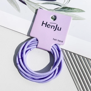 Close-up of high-elastic purple hair bands set on professional paper card packaging