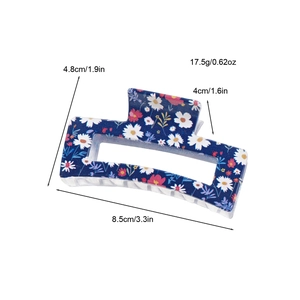 Floral print navy rectangle hair claw clip with daisy pattern measuring 8.5cm long