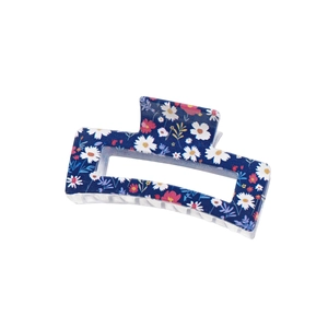 Navy blue rectangular claw clip with white daisy and pink floral UV print patterns