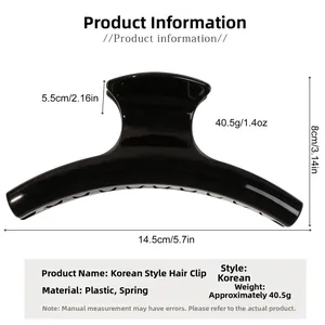 Detail view of a large black glossy hair claw clip with dimensions 14.5cm by 8cm