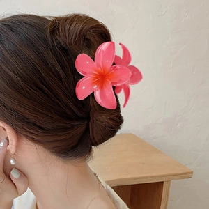 Frangipani flower hair claw clip in hot pink resin for beach vacations and styling