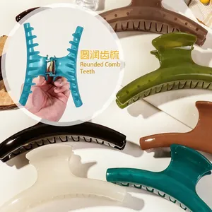 Minimalist glossy hair claw clips set in various solid colors with durable metal spring