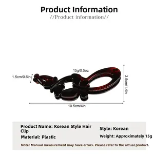 Detail view of double butterfly banana clip showing 10.5cm length and tortoise shell finish