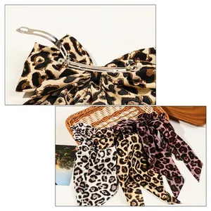 Vintage leopard print bow hair clip with long streamers and metal spring fastener