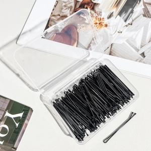 Bulk pack of black bobby pins with protective tips in a clear plastic storage box