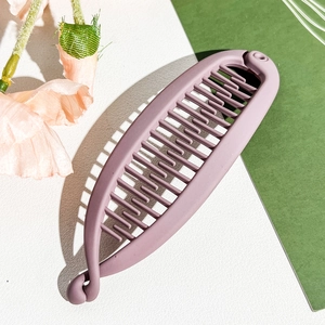 Detail of lavender matte banana hair clip with interlocking teeth for thick hair