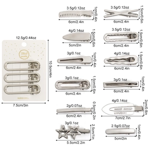 Lot de 12 barrettes en métal argenté de formes variées comme des étoiles sur fond blanc pur