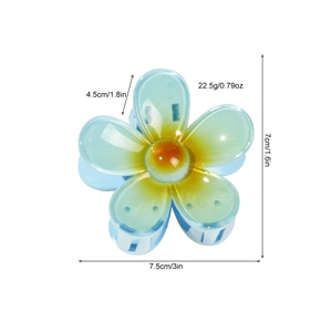 Pince à cheveux fleur bleu clair avec dimensions 7,5cm de large et poids de 22,5g
