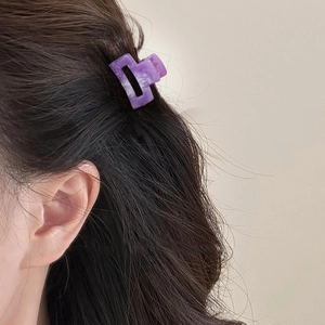 Purple marble square mini hair claw clip for girls shown on wavy hair accessory styling
