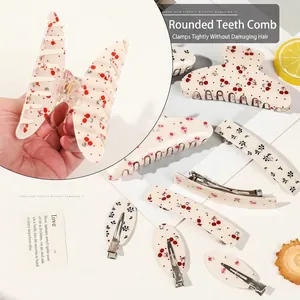 Floral hair claw clip set with cherry and rose patterns on cream acrylic base