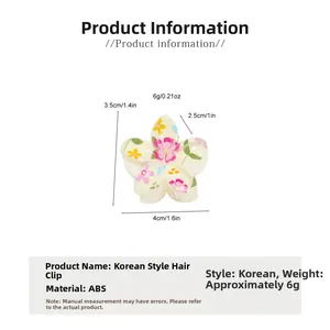 Detailed size chart for white floral hair claw showing dimensions of 4cm by 3.5cm