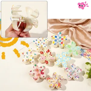 Tropical Frangipani hair claw clips with various floral and checkered resin patterns