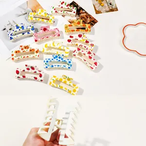 Large hair claw clips set with colorful UV fruit prints like strawberry and watermelon