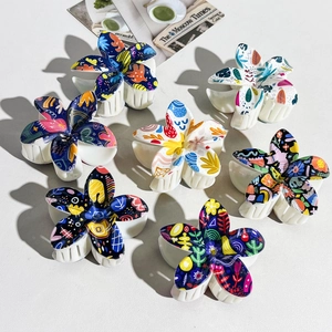 Set of 7 floral claw clips with colorful graffiti and dot patterns on white base