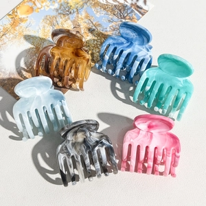 Set of 6 marble textured acetate hair claws in various colors for hair styling
