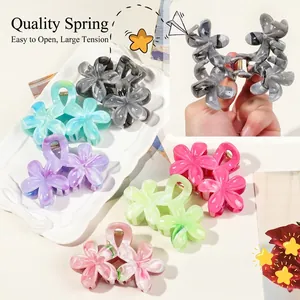 Elegant frangipani flower hair claw clips with marble texture for thick hair buns