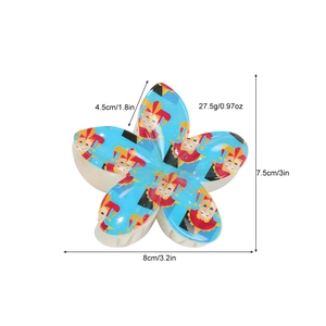 Blue flower hair claw clip with colorful jester pattern and dimensions 8cm by 7.5cm