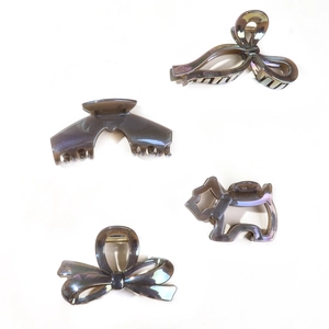 Set of four jelly grey iridescent hair claws with bow and puppy shapes for women
