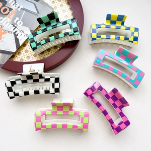 Detail of 8.5cm checkerboard hair claws in six vibrant candy colors and grid patterns