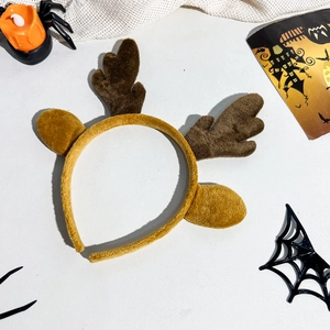 Close-up of plush reindeer antlers and ears headband for festive party costumes