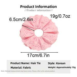 Pink lace fabric scrunchie detail with 17cm outer diameter and hollow embroidery style