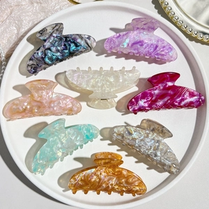 Set of seven large colorful acetic acid hair claws with iridescent marbled texture details