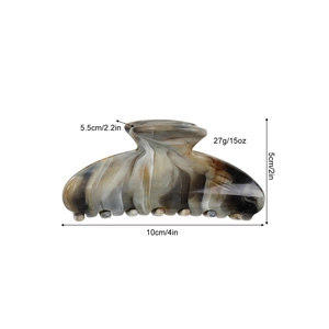 Large marble pattern hair claw clip in amber brown tones with 10cm product dimensions