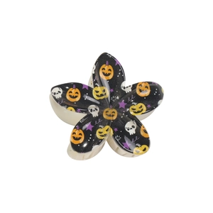 Halloween floral hair claw clip featuring pumpkin, skull and star patterns on black base