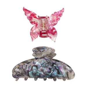 Set of two colorful acetate hair claws featuring a butterfly shape and marble texture design