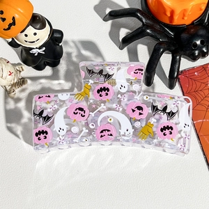 Square hair claw clip with Halloween pumpkin and ghost patterns on white texture