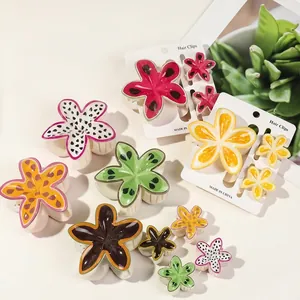Cute fruit and floral print hair clips featuring watermelon, kiwi and sunflower designs