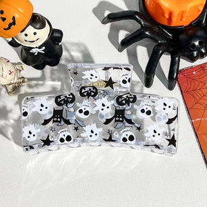 Detail of transparent 8.5cm square hair claw with Halloween ghost and bat prints