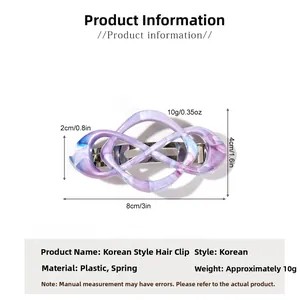 Detail view of marble pattern spring clip with size dimensions 8cm by 4cm for hair