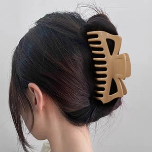 Matte beige large shark hair clip with hollow geometric design for French hair twist
