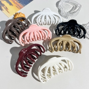 Flat lay of colorful octopus hair claws in glossy resin finish with various color options