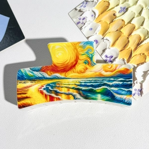 Macro view of artistic rectangular hair claw with Van Gogh style oil painting print