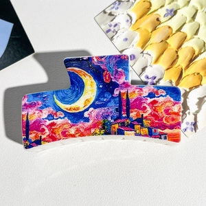 Artistic hair claw clip with Van Gogh starry night painting print on leather background