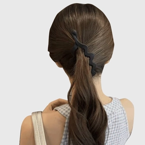 Matte black large banana clip for thick hair styling on a high ponytail twist