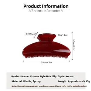 Deep red translucent hair claw clip with size measurements in centimeters and inches