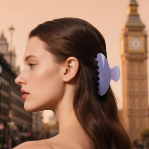 Elegant lavender half-circle hair claw clip worn by a woman with Big Ben city background