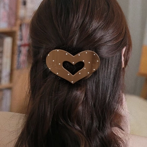 Flat oval heart-shaped hair claw clip with white polka dots for women’s long hair styling
