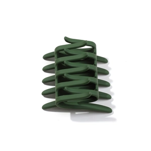 Minimalist dark green matte hair claw clip with interlocking teeth for women styling