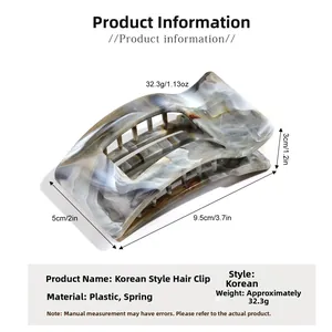 Macro detail of marble pattern square hair claw clip with size dimensions 9.5x5x3 cm