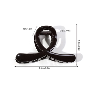 Minimalist black infinity shark hair claw clip in high gloss finish for medium thick hair